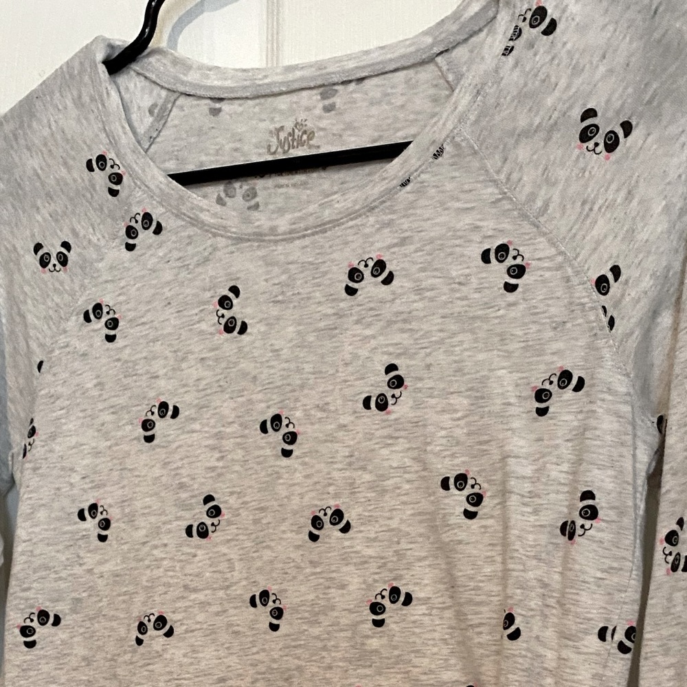 A white long sleeve top with panda’s